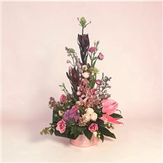 Exotic pink hat box arrangement Small